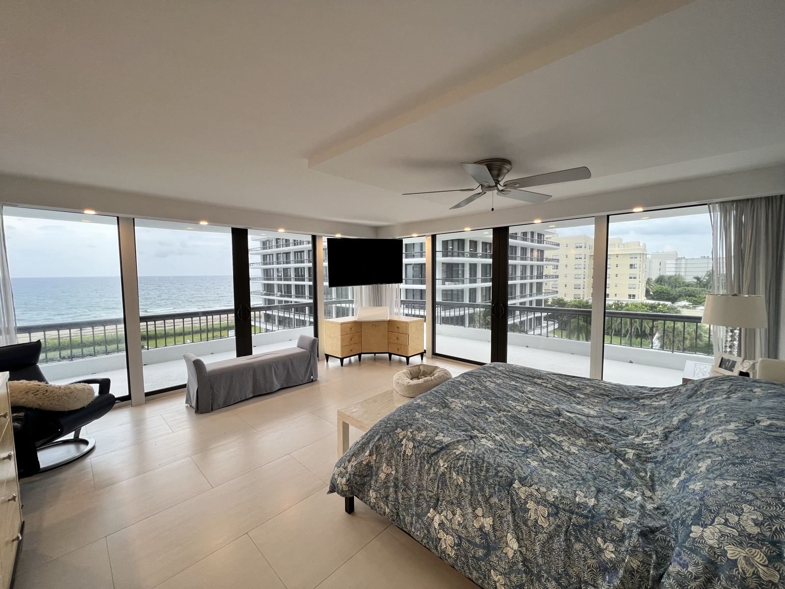 Oceanfront bedroom with the shades raised, open to the view
