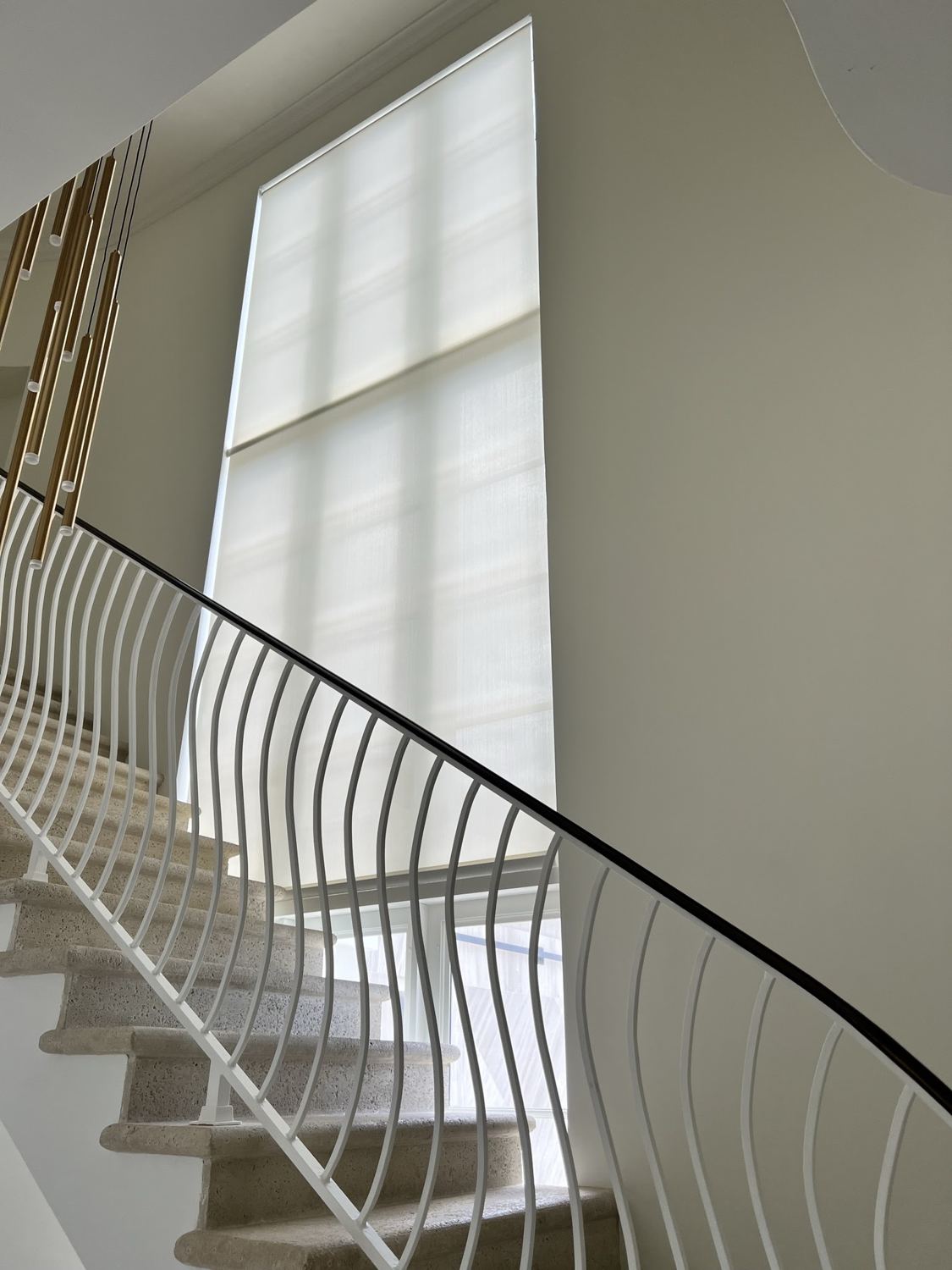 The same window with a roller shade installed
